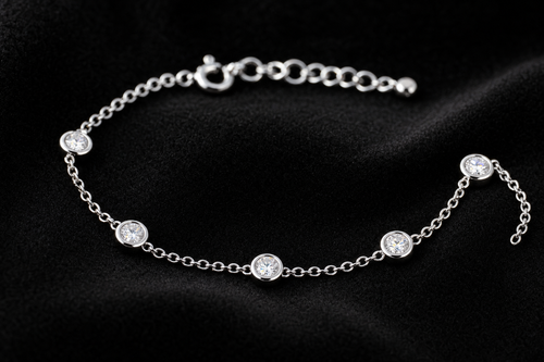 Moissanite Bezel Station Bracelet on black velvet
