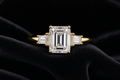 Emerald Cut Moissanite Three-Stone Ring on black velvet
