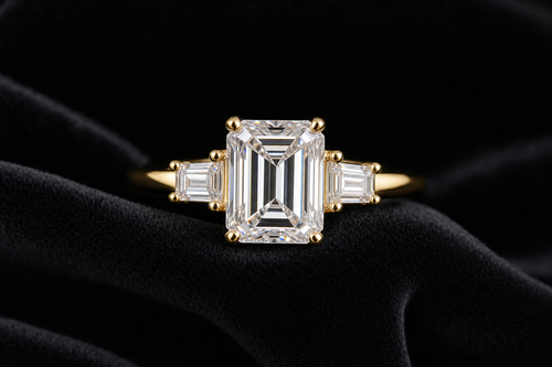 Emerald Cut Moissanite Three-Stone Ring on black velvet