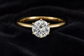 Round Brilliant Moissanite Solitaire Ring on black velvet