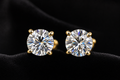 Round Moissanite Stud Earrings on black velvet