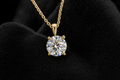 Round Moissanite Solitaire Pendant on black velvet